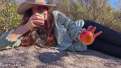 "Cowgirl Eats an Apple Outside in the Sunlight"