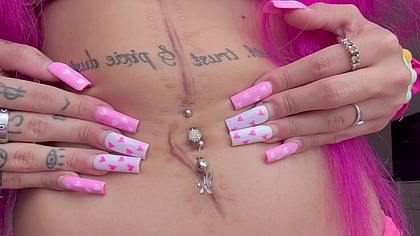 Belly Button Stretching Close-Up to the Camera with Long Nails