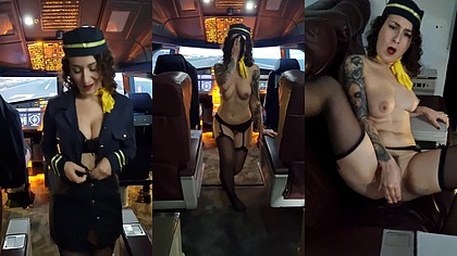 The flight attendant puts a dildo in her pussy on board
