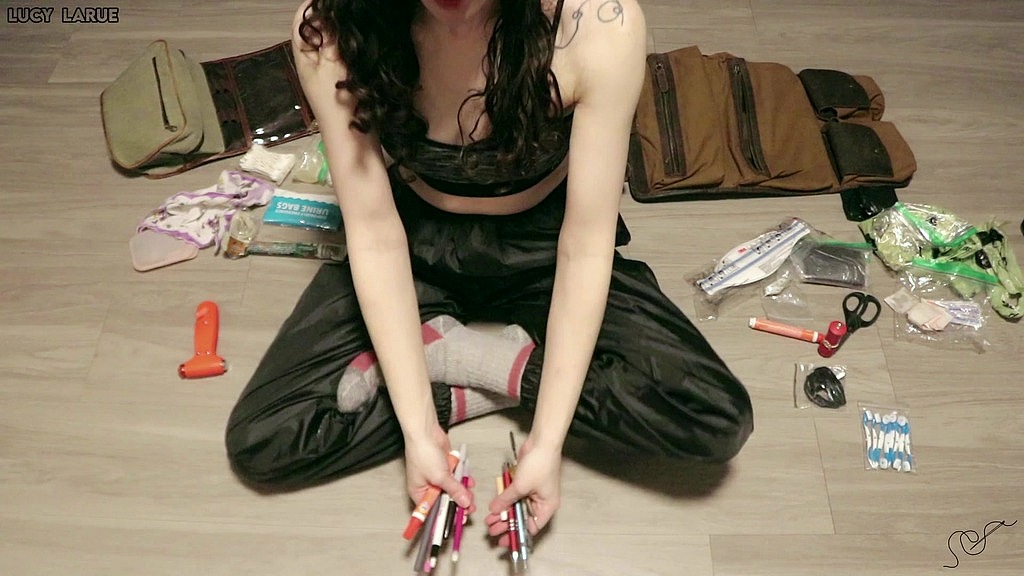 organizing travel bags in sports bra and windbreaker pants (Lucy LaRue) organizing travel bags in sports bra and windbreaker pants (Lucy LaRue)