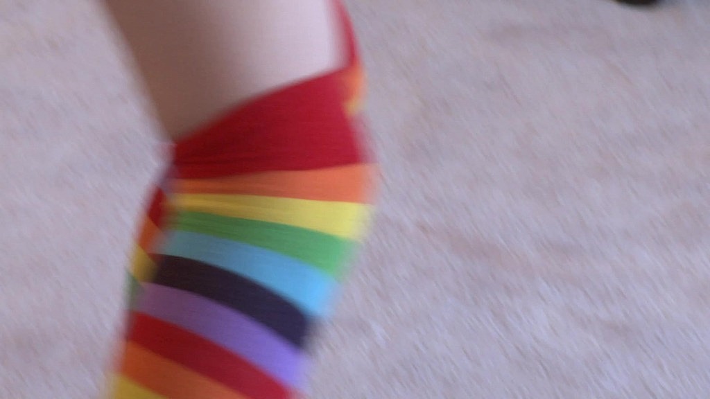lexi belle keeps her rainbow sox on as she rides a big dick