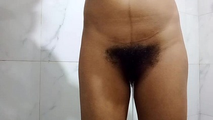 busty Asian woman pissing while bathing