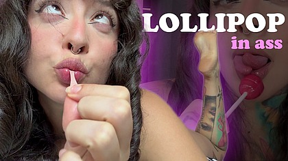 Girl with split tongue licks a lollipop and puts in ass