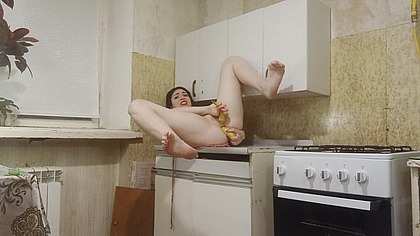 Double penetration with bananas in the kitchen