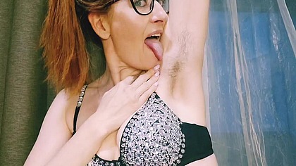 An aunt with glasses and fishnet tights is flirting with you