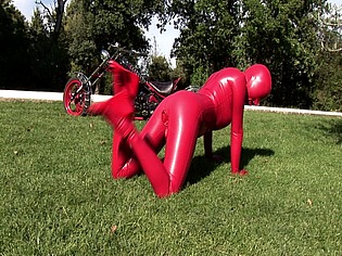 Busty babe toying in full latexwear