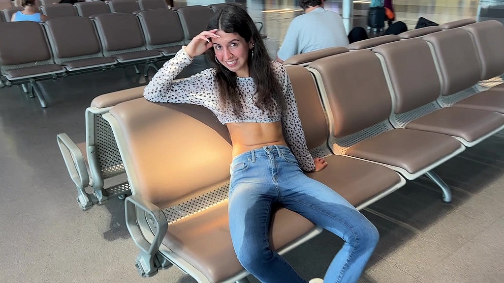 risky wetting jeans in airport public pee desperation (Katty West) risky wetting jeans in airport public pee desperation (Katty West)