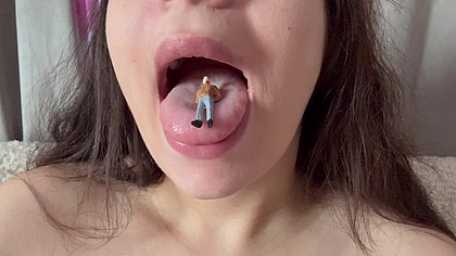 A giantess humiliates her tiny husband by taking it into her mouth and sucking it like a delicious candy, then playing with it and sticking it in his nose,