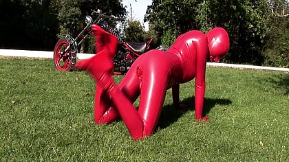 Busty babe toying in full latexwear