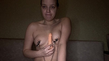 A young amateur with clamps on her nipples whips herself and then sucks a dirty fake cock just pulled out from her tight hole