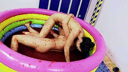 Two hotties in stockings have playful wrestle in a small pool