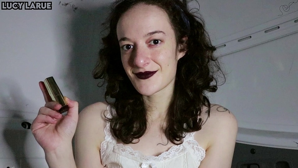 applying my dark purple lipstick in the porn van (Lucy LaRue) applying my dark purple lipstick in the porn van (Lucy LaRue)