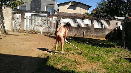 Housewife working naked in front yard while people was walking on street