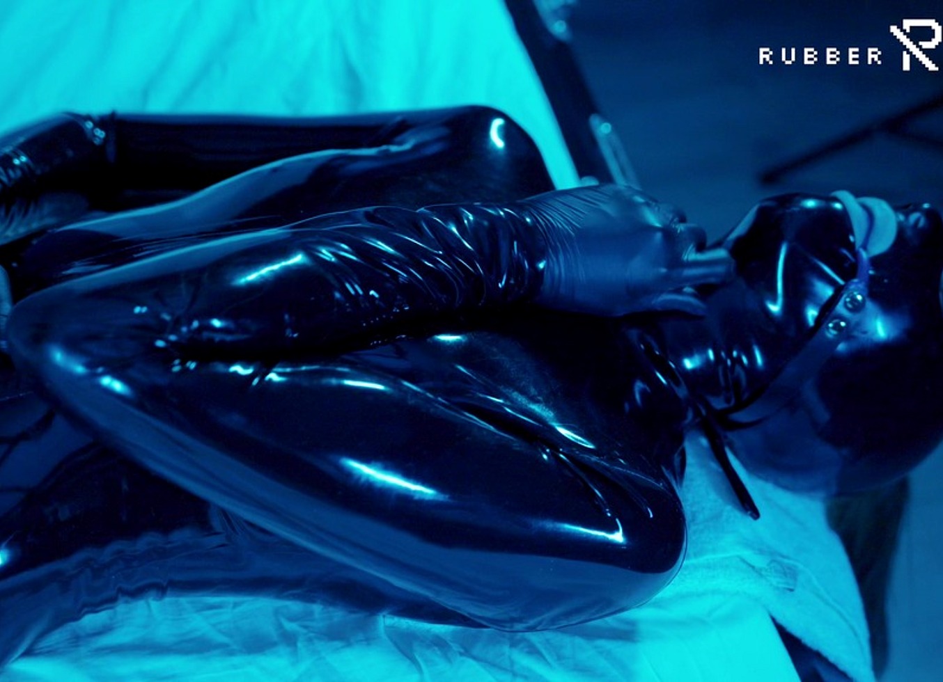 Tied Up Rubber Girl in Catsuit Fucking Herself