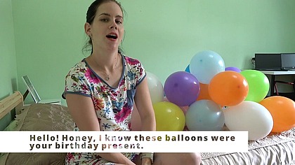 Anna blows balloons in front of you
