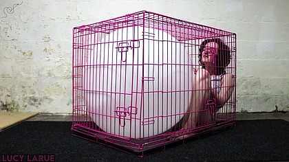 "Kenneled Vibe Orgasm Struggling with a Big White Balloon"