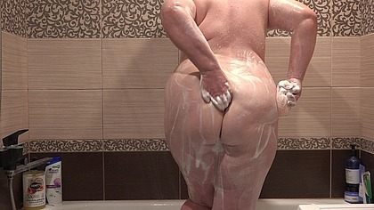 A mature stepmom forgot to close the bathroom door. A BBW with a big ass and big tits.