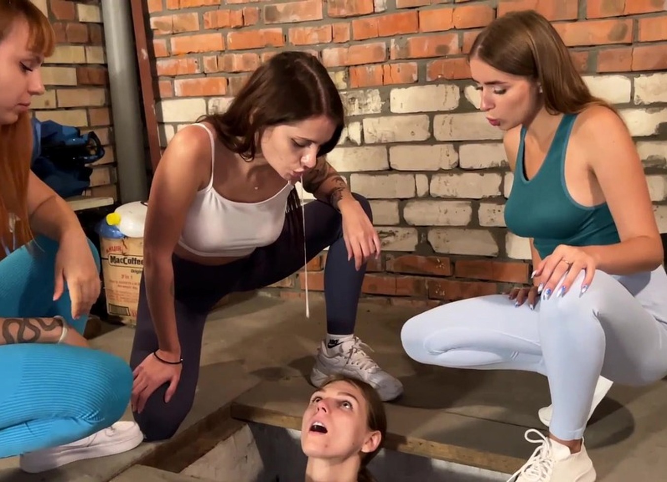 Three Girls Spitting on a Slave Captive in Dirty Basement