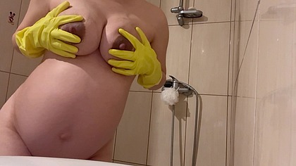 My Stepmom takes a shower in yellow latex gloves and washes her body with lots of white foam